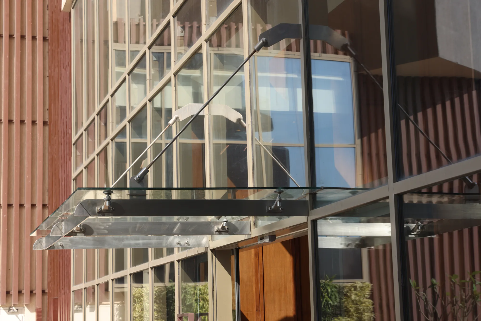 Glazed curtain wall beside the pool