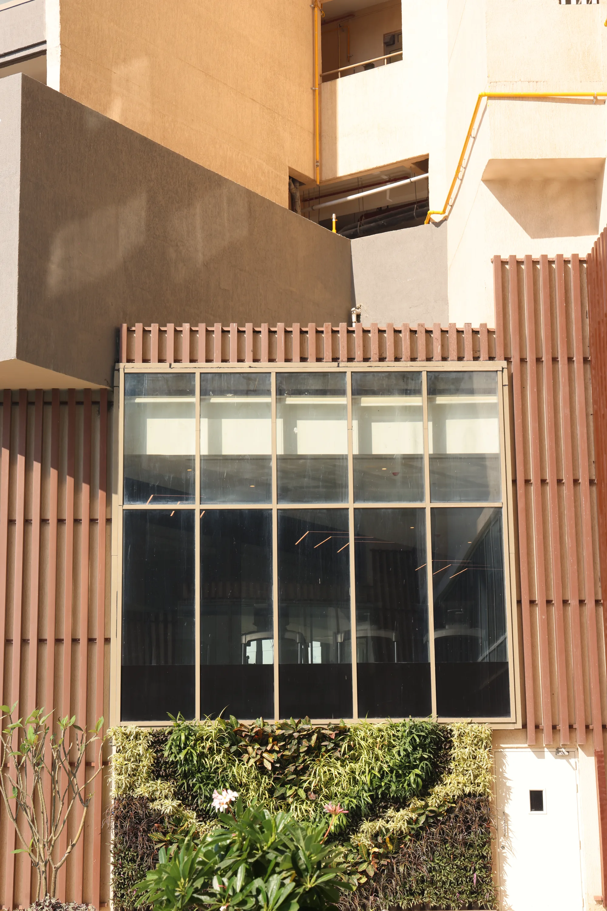 Glazed window bay in a timber-clad facade