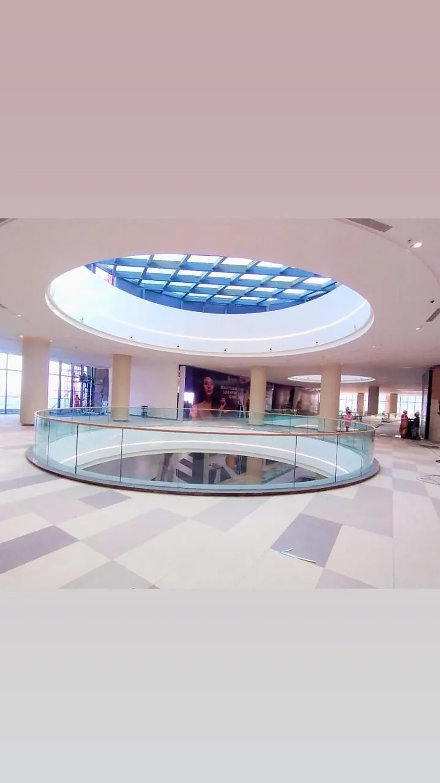 Circular atrium with a glass balustrade at InOrbit Mall